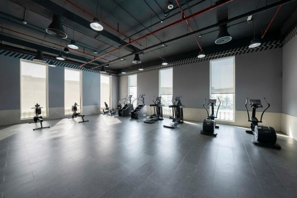 An empty gym with a lot of exercise equipment
